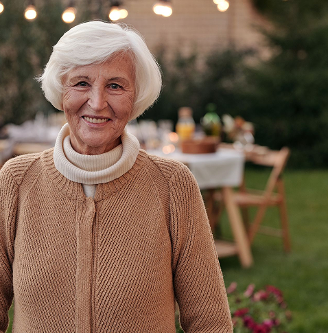 Confident older woman in a garden
